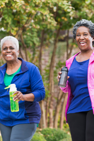 Two women holding water bottles