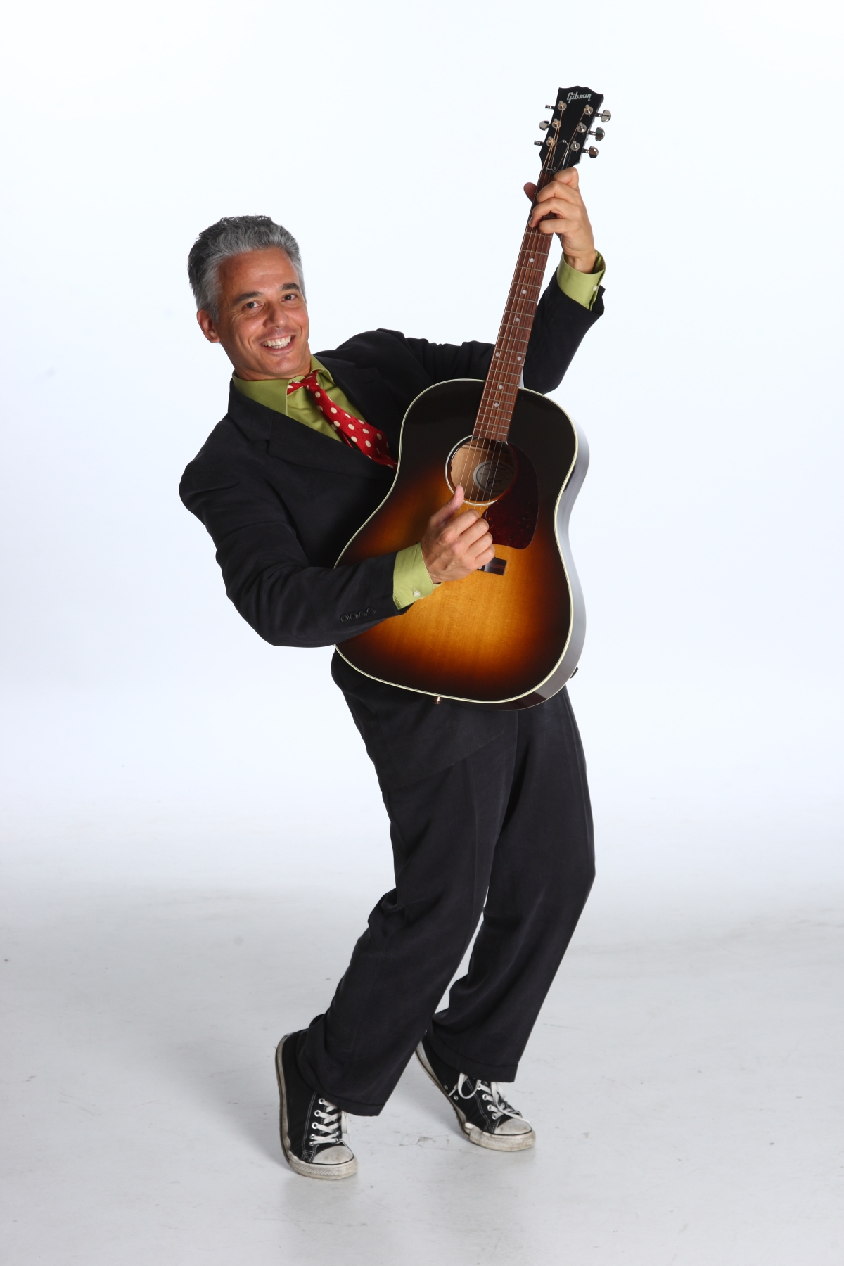 Photo of Mr. Richard posing with his guitar