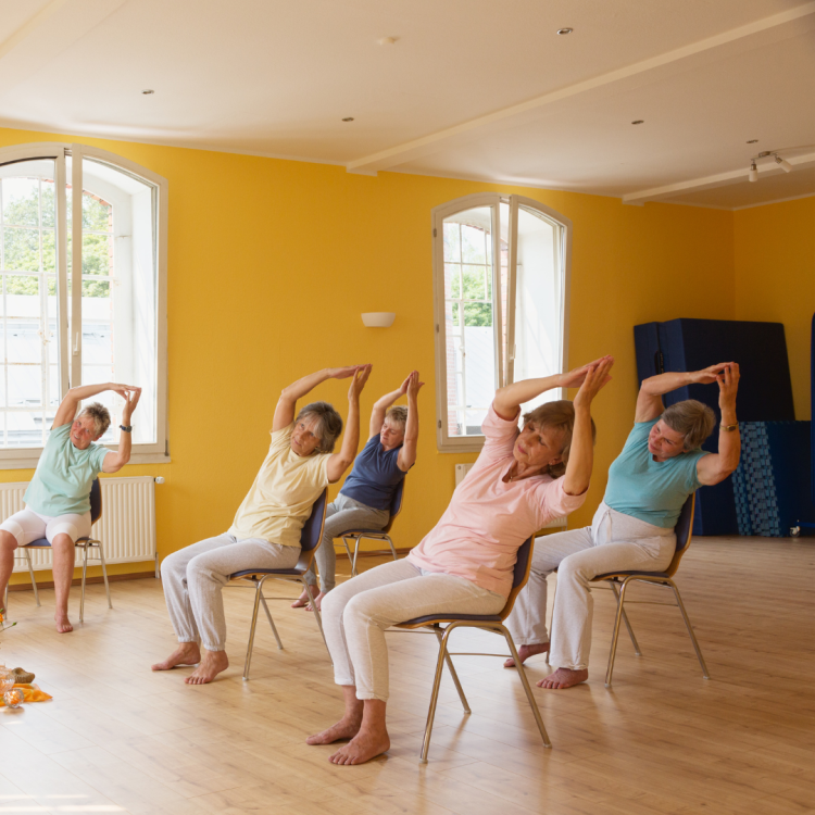 People dong stretches in their chairs