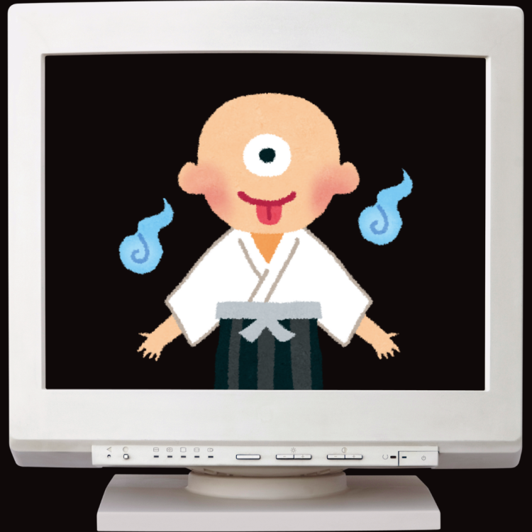 A computer with an illustrated yokai on the screen.