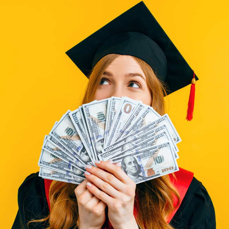 A graduate fanning out money.